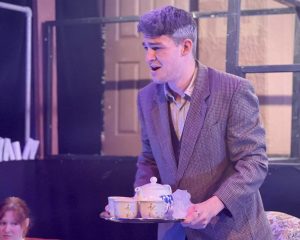 Image of the drunken butler, played by Fletcher Stafford.